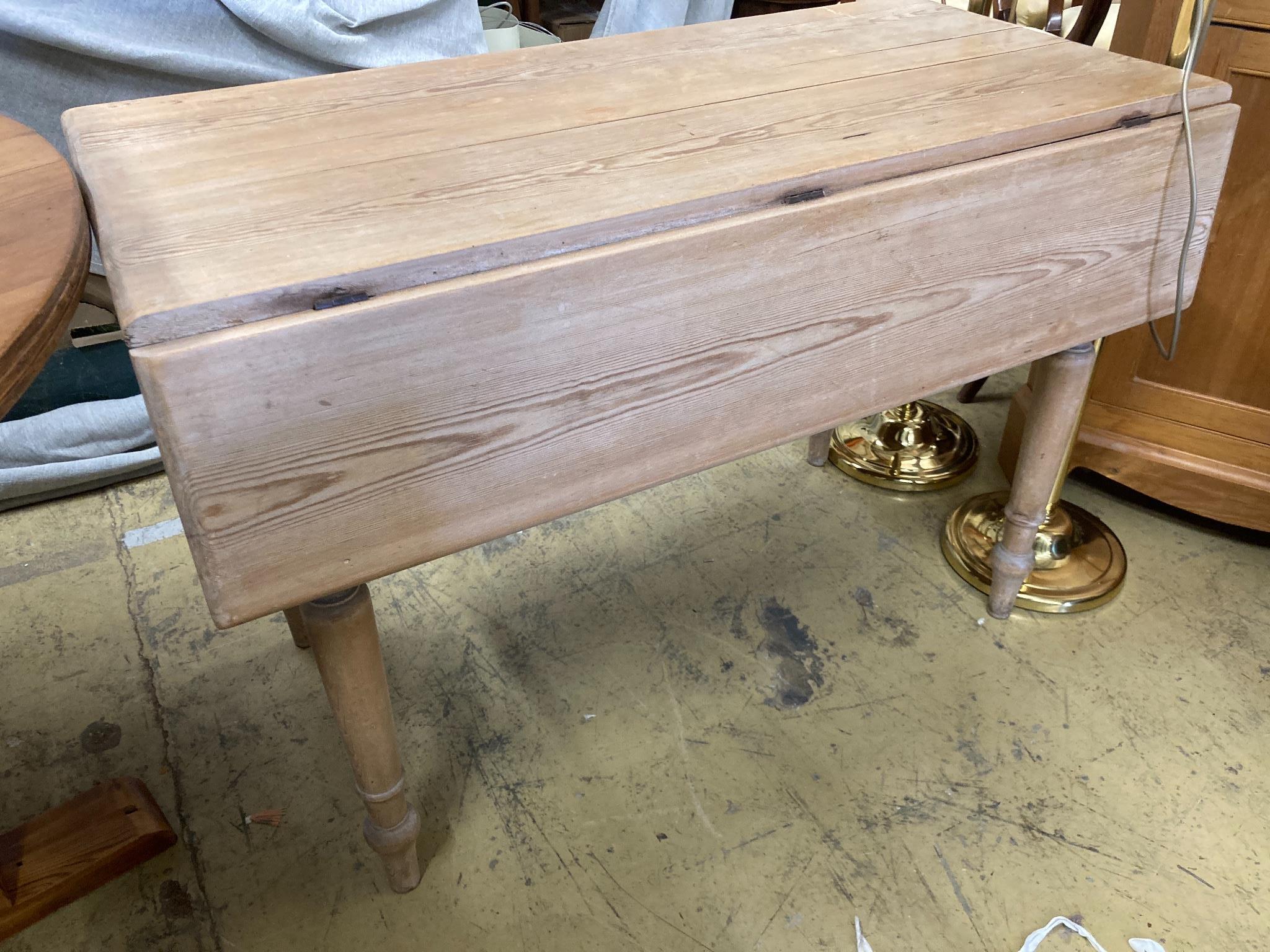 A Victoiran pine drop leaf kitchen table, width 106cm, depth 54cm, height 72cm